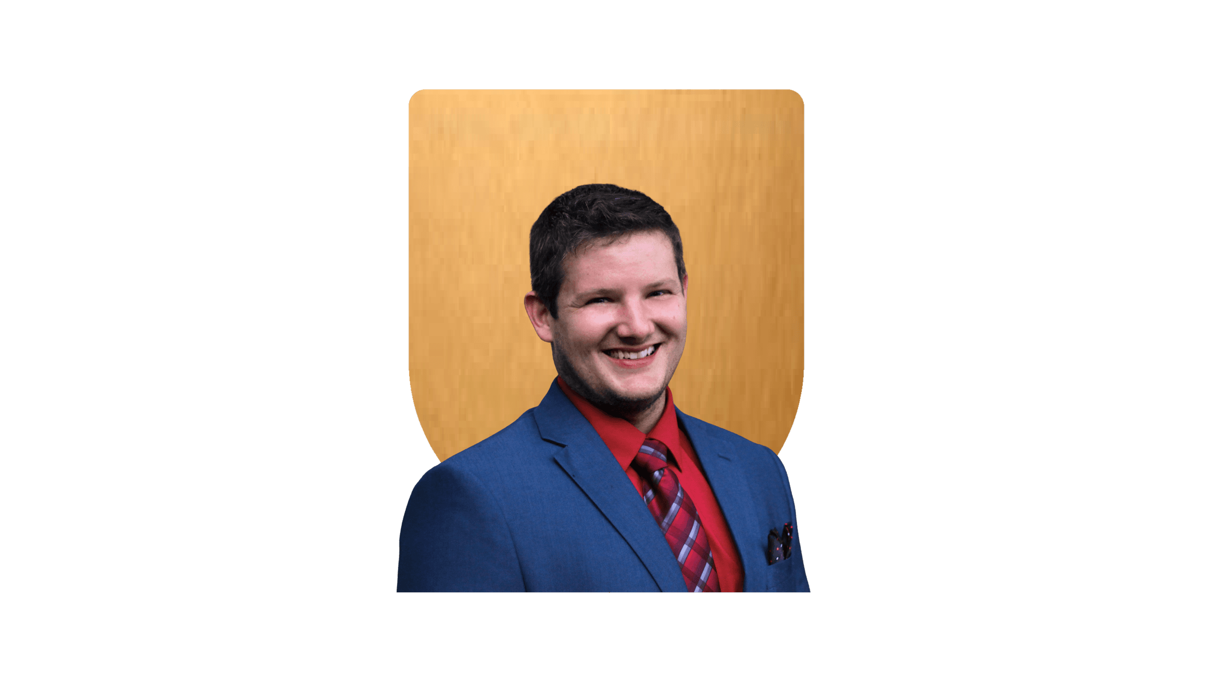 Man in blue suit with red shirt and tie smiling, with a gold shield shape background.